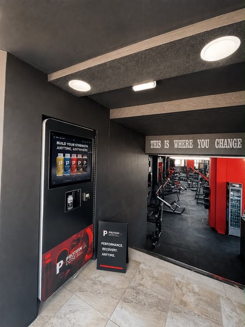 Protein Dose machine installed at a gym entrance